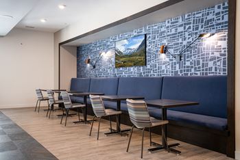 Recreation room w/ fireplace, lounge space  and banquet seating